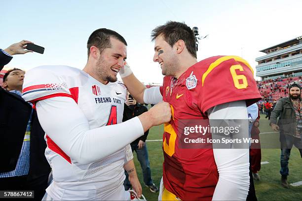 Fresno State Bulldogs quarterback Derek Carr and USC Trojans quarterback Cody Kessler during the NCAA Football Royal Purple Las Vegas Bowl game at...