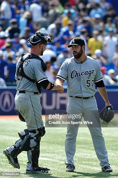 Chicago White Sox catcher Tyler Flowers celebrates with pitcher Zach Putnam . The Chicago White Sox defeated the Toronto Blue Jays 4 - 3 at the...