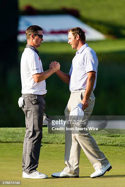 Shawn Stefani congratulates Justin Rose after Rose wins in a one hole playoff during the final round of the Quicken Loans National at Congressional...