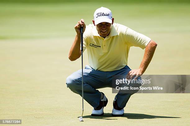 Bill Haas lines up his putt on the 3rd green during the final round of the Quicken Loans National at Congressional Country Club in Bethesda, MD.