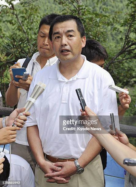 Japan - Japan Airlines President Masaru Onishi speaks to reporters at the site of the 1985 JAL jumbo jet crash at Osutaka Ridge in the village of...