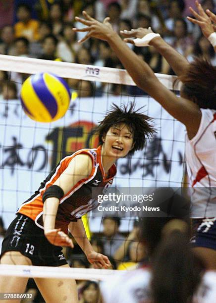 Japan - Japan's Saori Kimura spikes the ball in the third set of a preliminary round match of the women's World Grand Prix against the Dominican...