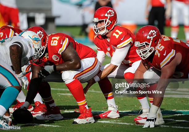 Kansas City Chiefs Quarterback Alex Smith prepares to take the snap of the ball from Kansas City Chiefs Center Rodney Hudson with Kansas City Chiefs...