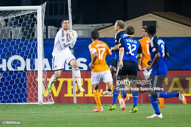 Houston Dynamo goalkeeper Tally Hall makes a save in front of goal after a strike by San Jose Earthquakes forward Steven Lenhart , as Houston Dynamo...