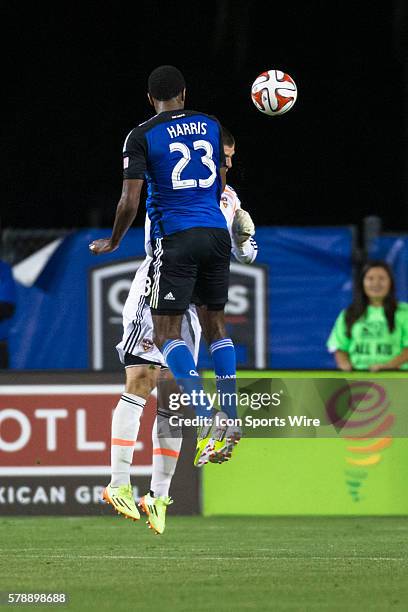 San Jose Earthquakes midfielder/forward Atiba Harris heads the ball past Houston Dynamo goalkeeper Tally Hall towards the goal, during the game...