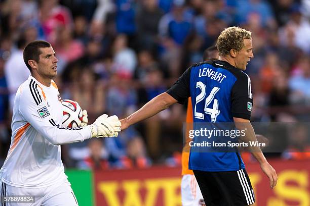 San Jose Earthquakes forward Steven Lenhart reaches out to Houston Dynamo goalkeeper Tally Hall during the game between the San Jose Earthquakes and...