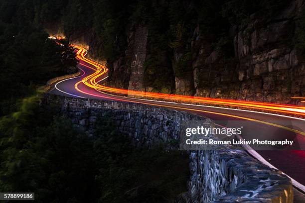 long exposure winding road - winding road night stock pictures, royalty-free photos & images