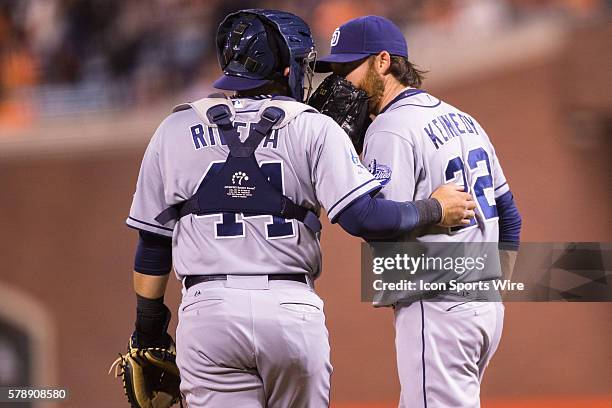 San Diego Padres starting pitcher Ian Kennedy and San Diego Padres catcher Rene Rivera talking during a break, during the game between the San...