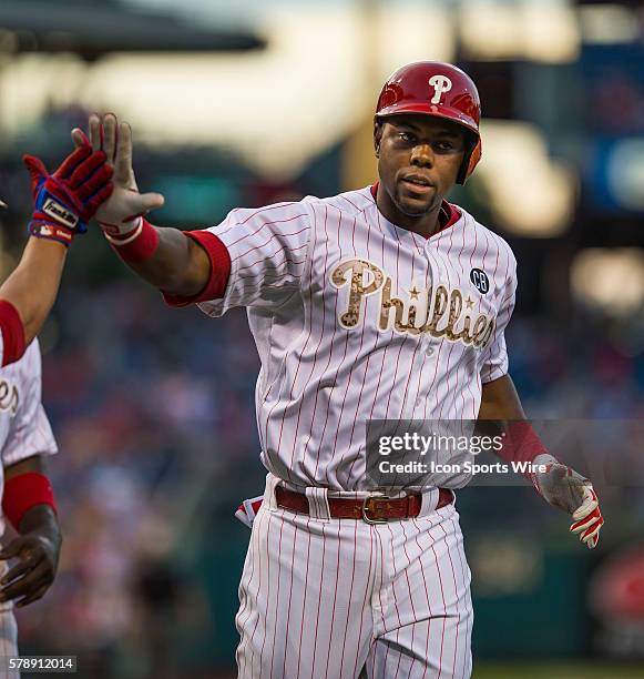 Philadelphia Phillies left fielder Domonic Brown homers in the bottom of the seventh inning during a Major League Baseball game between the...