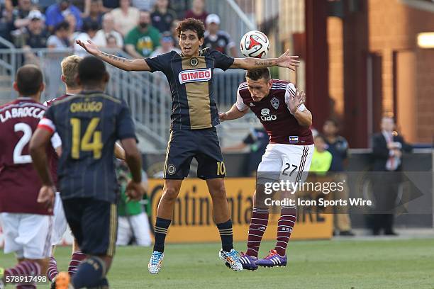 Philadelphia Union midfielder Cristian Maidana and Colorado Rapids defender Shane O'Neill compete in a Major League Soccer match at PPL Park in...