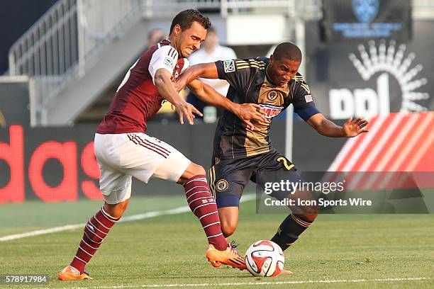 Colorado Rapids forward Kamani Hill and Philadelphia Union defender Raymon Gaddis compete for the ball in a Major League Soccer match at PPL Park in...