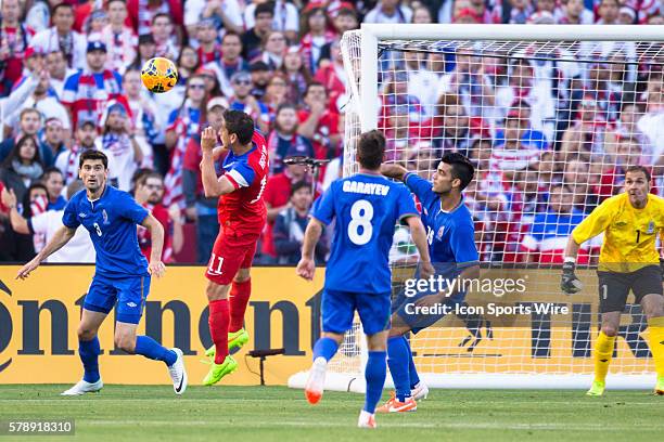 United States midfielder Alejandro Bedoya gets a head on the ball as Azerbaijan defender Rasim Ramaldanov and Azerbaijan midfielder Gara Garayev...