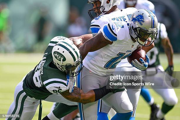 Detroit Lions wide receiver Jeremy Ross is taken down by New York Jets strong safety Dawan Landry during the first half of a NFL matchup between the...