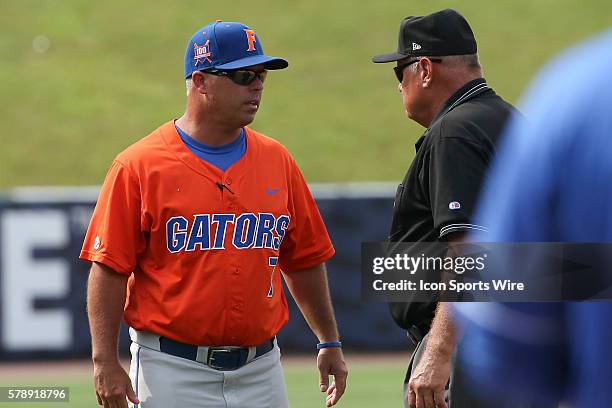 Florida head coach, Kevin O'Sullivan, discusses a call with one of the umpires during the2014 Southeastern Conference Baseball Championships at...