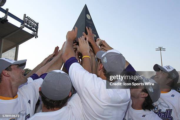 Players hold up the 2014 SEC Championship Trophy during the2014 Southeastern Conference Baseball Championships at Hoover Metropolitan Stadium,...