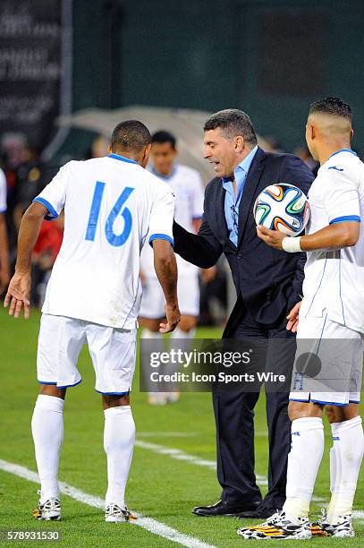 Honduras National Team head coach Luis Fernando Surez talks with Honduras forward Rony Martinez in action against the Turkish National Team in a Road...
