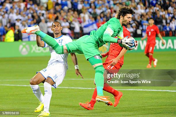 Turkey goal keeper Tolga Zengin makes a save on shot by Honduras forward Jerry Bengtson in a Road to Brazil friendly match at RRK Memorial stadium in...