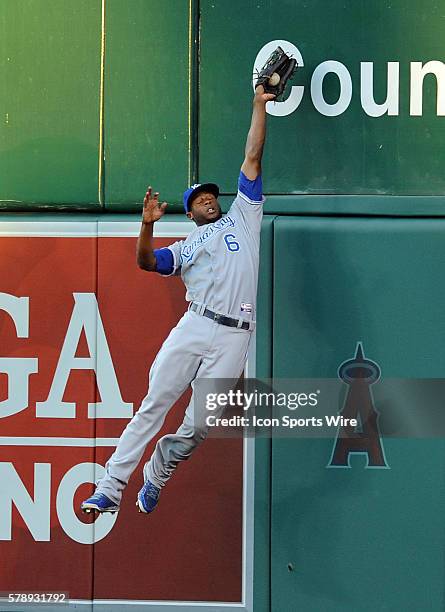 Kansas City Royals center fielder Lorenzo Cain leaps and catches a fly ball against the wall in the first inning during ALDS game one against the Los...