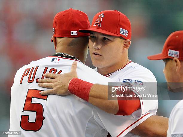 Los Angeles Angels of Anaheim Mike Trout hugs Albert Pujols during player introductions before ALDS game one against the Kansas City Royals played at...