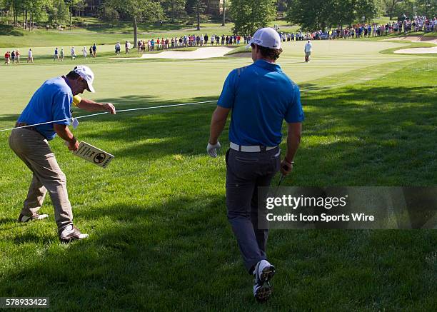 Rory McIlroy walking back onto the course after hitting the ball into a tree on the 13th hole during the Second Round of the Memorial Tournament...