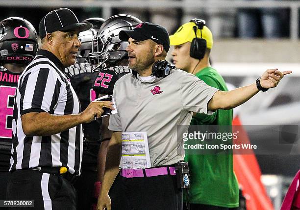 Oregon Ducks head coach Mark Helfrich questions a official during the game between the Arizona Wildcats and the Oregon Ducks at Autzen Stadium in...