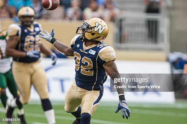 July 2014 Blue Bombers Nic Grisby tries to catch a pass during the Eskimos vs Bombers game at the Investors Group Field in Winnipeg MB.