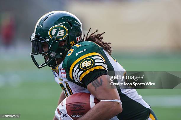 July 2014 Eskimos Calvin McCarthy runs with the ball during the Eskimos vs Bombers game at the Investors Group Field in Winnipeg MB.