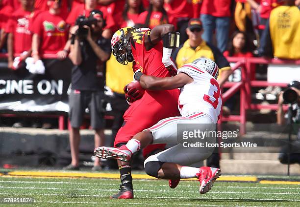 Ohio State Buckeyes linebacker Joshua Perry hauls down Maryland Terrapins running back Wes Brown during a Big East football game at Capital One Field...