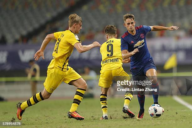 Adnan Januzaj of Manchester United competes for the ball with Jacob Bruun Larsen of Borussia Dortmund during the International Champions Cup match...
