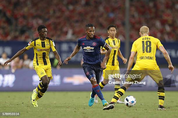 Memphis Depay of Manchester United competes for the ball with Sebastian Rode of Borussia Dortmund during the International Champions Cup match...