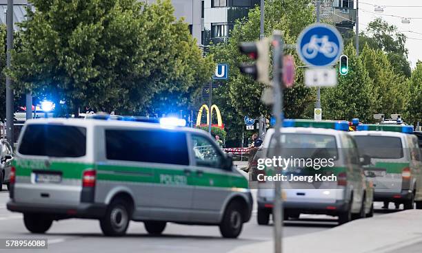 Police officers are parked near the McDonalds at the shopping center as they respond to a shooting at the Olympia Einkaufzentrum at July 22, 2016 in...