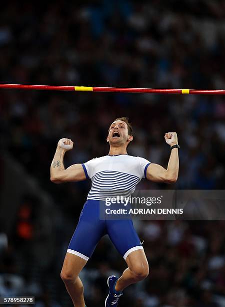 France's Renaud Lavillenie reacts as he clears 5.90 during the men's pole vault event at the IAAF Diamond League Anniversary Games athletics meeting...