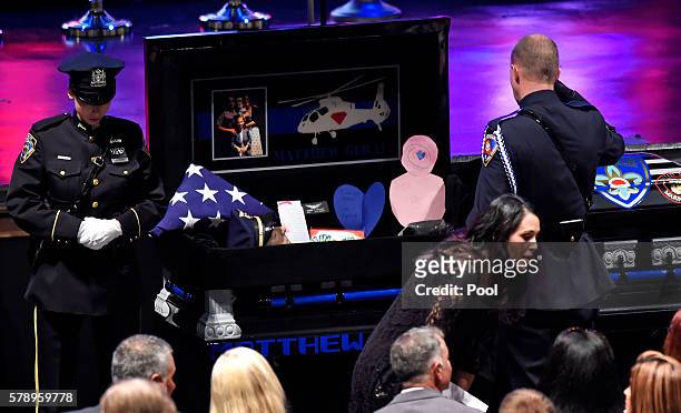 Mourners pay respect to the casket of Baton Rouge police officer Matthew Gerald at the Healing Place Church July 22, 2016 in Baton Rouge, Louisiana....