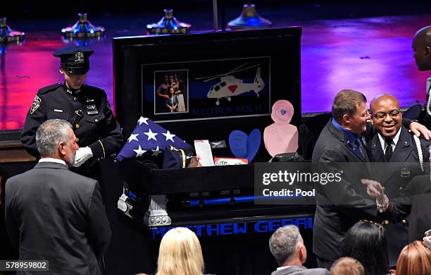 Mourners pay respect to the casket of Baton Rouge police officer Matthew Gerald at the Healing Place Church July 22, 2016 in Baton Rouge, Louisiana....