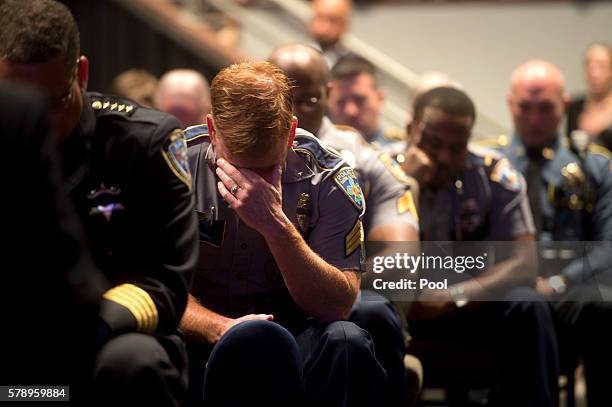 Police offer bows his head during funeral services for Baton Rouge police officer Matthew Gerald at the Healing Place Church July 22, 2016 in Baton...