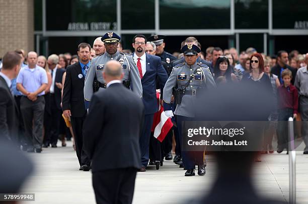 Pallbearers hold the casket of Baton Rouge Police Officer Matthew Gerald during his funeral at Healing Place Church Arena on July 22, 2016 in Baton...