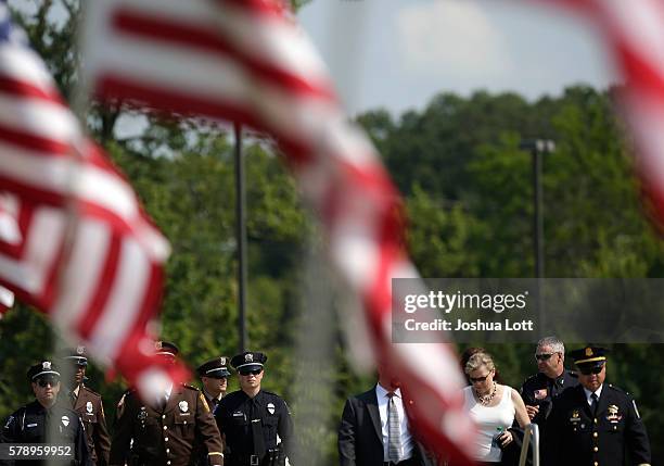 Police officers arrive for the funeral of Baton Rouge Police Officer Matthew Gerald at Healing Place Church Arena on July 22, 2016 in Baton Rouge,...