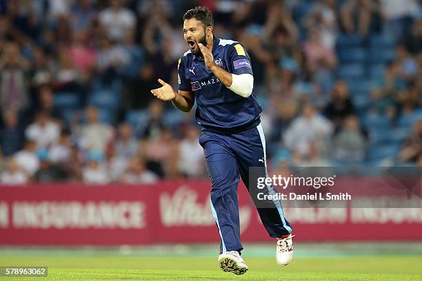 Azeem Rafiq of Yorkshire celebrates dismissing Graeme White of Northampton during the NatWest T20 Blast match between Yorkshire Vikings and...