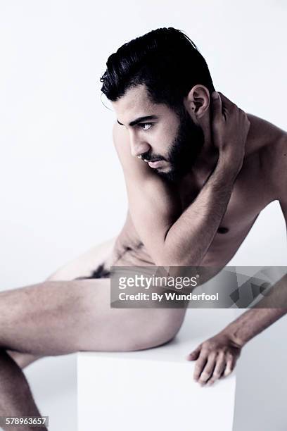 male dancer sitting naked on a white block - pubic hair stock pictures, royalty-free photos & images