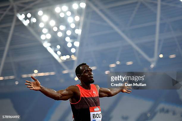 Usain Bolt of Jamaica celebrates after winning the mens 200m during Day One of the Muller Anniversary Games at The Stadium - Queen Elizabeth Olympic...
