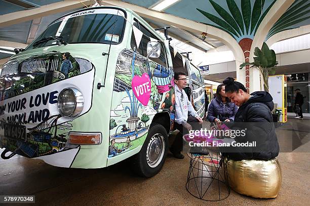 Glyn Walters, Auckland Council Elections Planning Manager and students Honeofaefita Taungapeau and Meliana Minoteti with the Love Bus at Mangere Town...