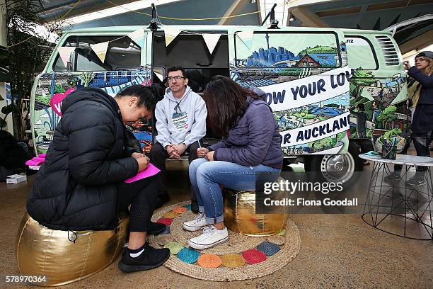 Glyn Walters, Auckland Council Elections Planning Manager and students Honeofaefita Taungapeau and Meliana Minoteti with the Love Bus at Mangere Town...