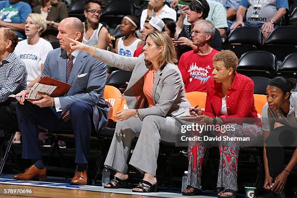 Head Coach Cheryl Reeve of the Minnesota Lynx with Assistant Coaches Jim Petersen and Shelley Patterson and Renee Montgomery react to a play against...