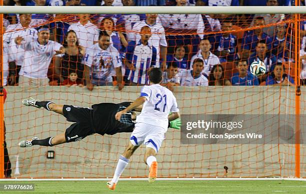 Israel goalkeeper Ariel Harush dives for the ball during the FIFA International friendly soccer match, Honduras vs Israel at BBVA Compass Stadium in...