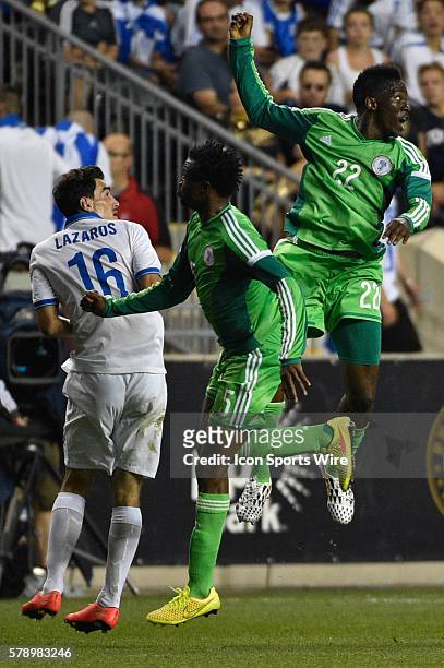 Nigerian national Kenneth Omeruo and Efe Ambrose battle Greek national Lazaros Christodoulopoulos during a International Friendly at PPL Park in...