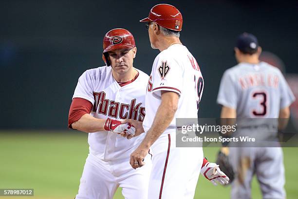 Jul 22, 2014; Arizona Diamondbacks catcher Miguel Montero slaps hands with Arizona Diamondbacks first base coach Dave McKay after hitting a two-RBI...