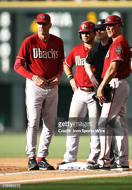 Arizona Diamondbacks Manager, Kirk Gibson visits first base along with Outfielder, Gerardo Parra and First Base Coach, Dave McKay after a...