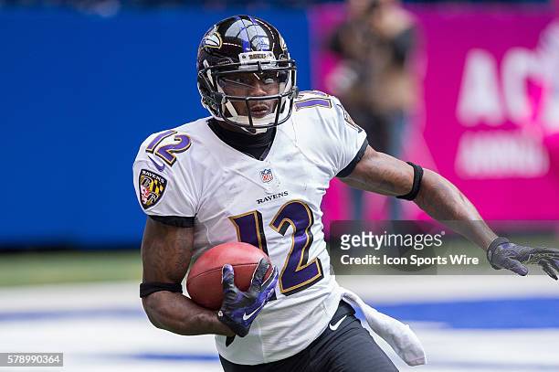 Baltimore Ravens wide receiver Jacoby Jones returns a kickoff during a football game between the Indianapolis Colts and Baltimore Ravens at Lucas Oil...
