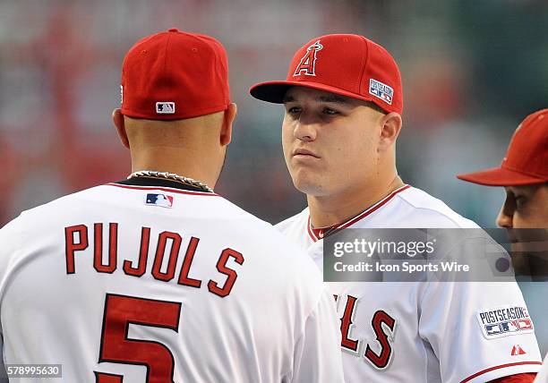 Los Angeles Angels of Anaheim Mike Trout hugs Albert Pujols during player introductions before ALDS game one against the Kansas City Royals played at...