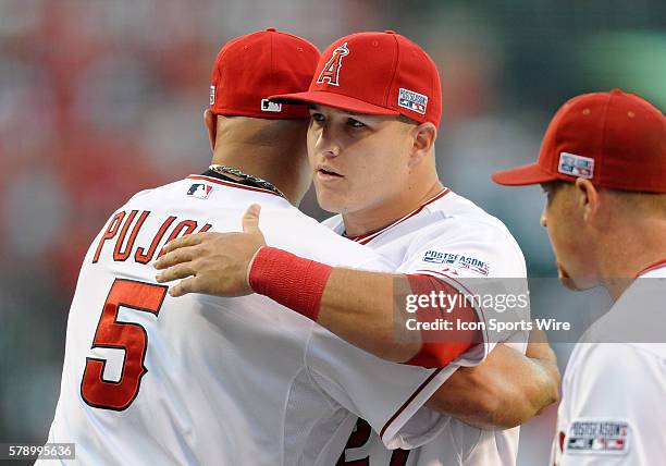 Los Angeles Angels of Anaheim Mike Trout hugs Albert Pujols during player introductions before ALDS game one against the Kansas City Royals played at...